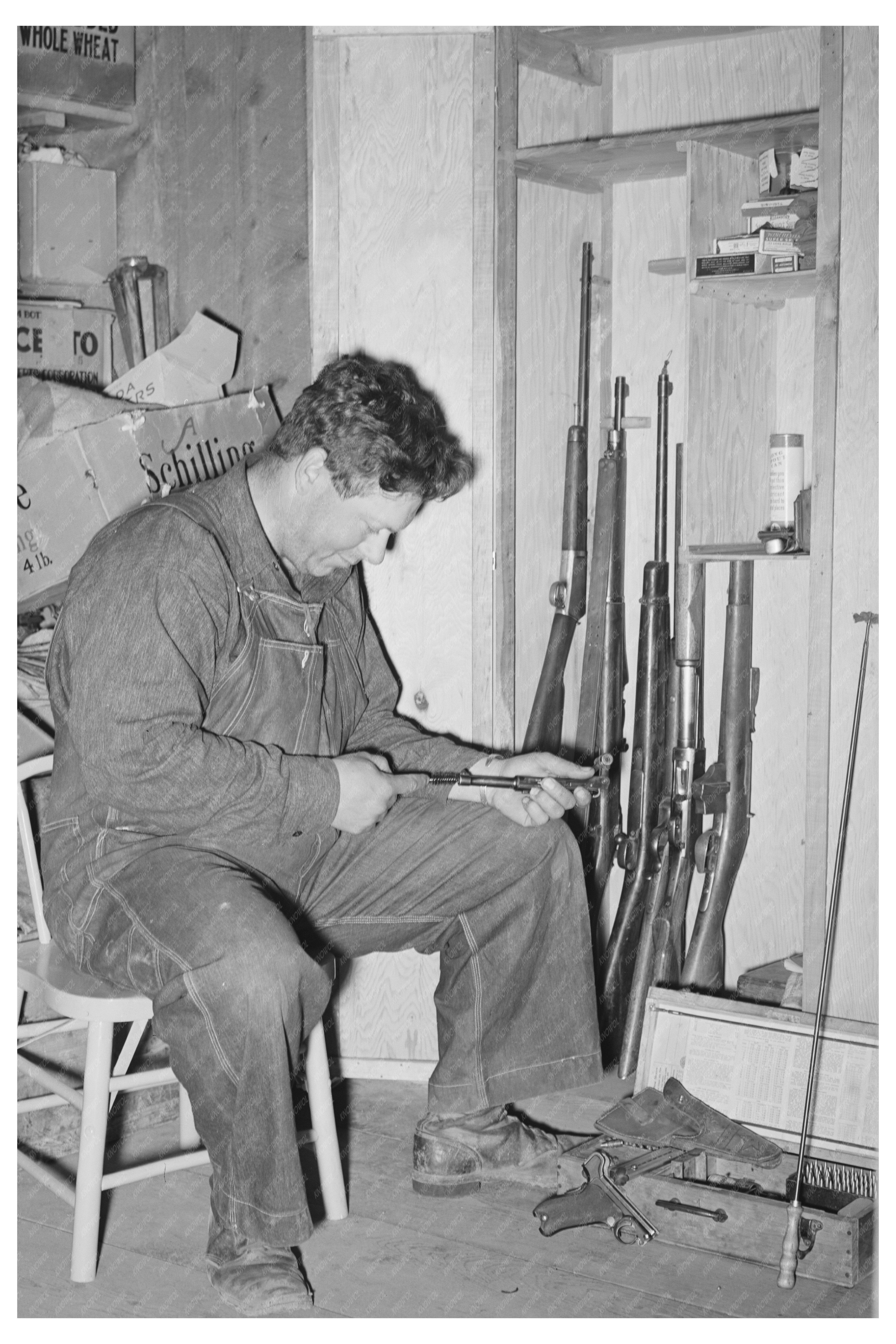 George Hutton Jr. with Firearms in Pie Town NM 1940