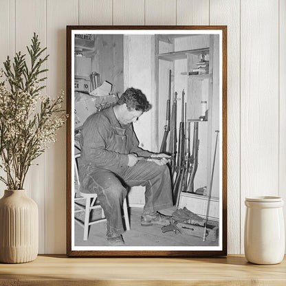 George Hutton Jr. with Firearms in Pie Town NM 1940