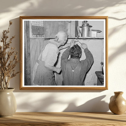 Mrs. Hutton and Son Papering Kitchen in Pie Town 1940