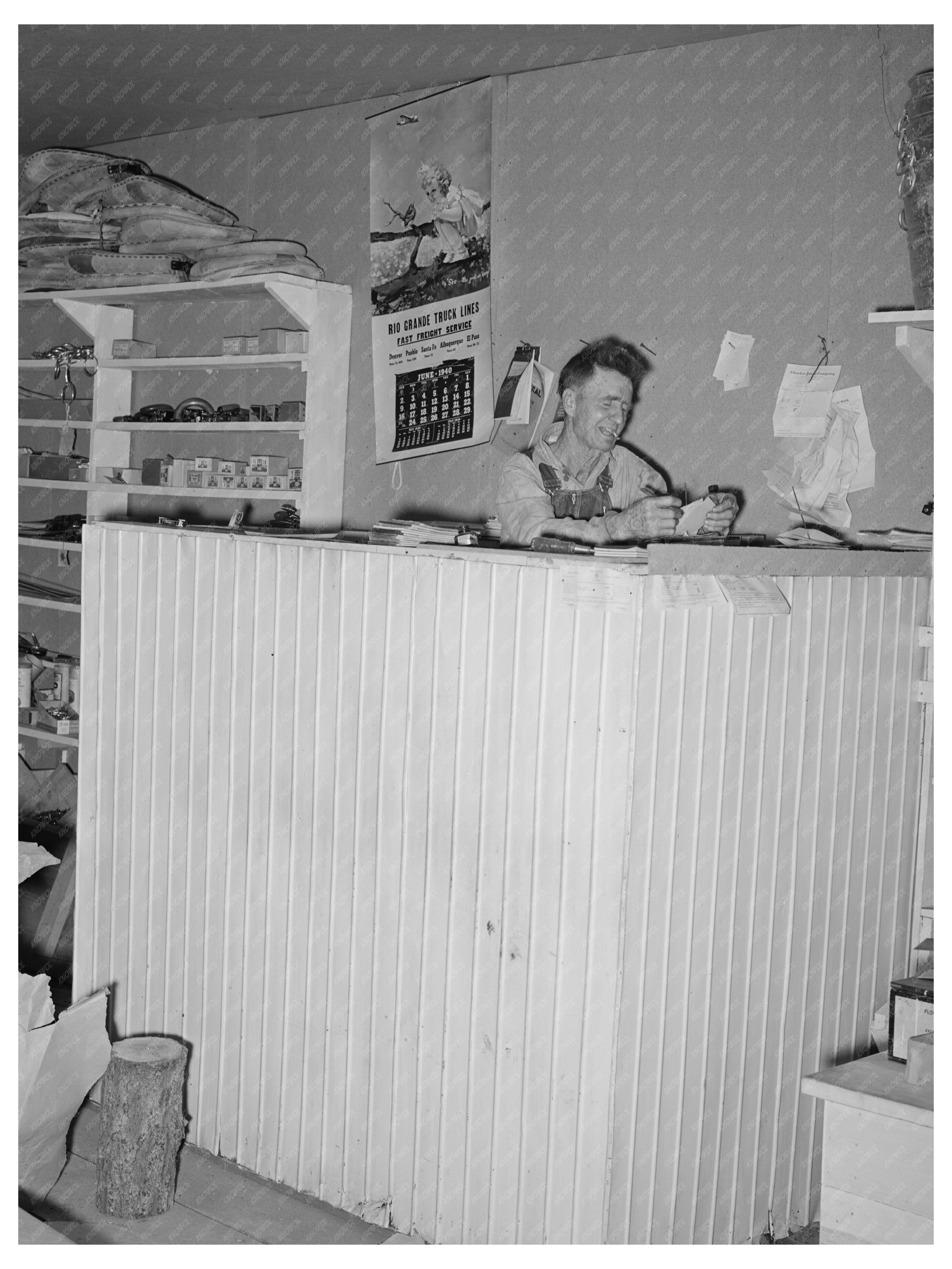 Mr. Craig Paying Bills in Pie Town New Mexico June 1940