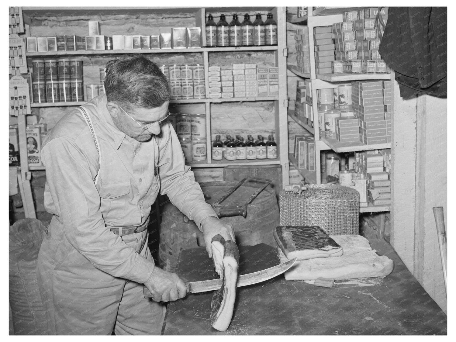 Mr. Keele Slicing Bacon in Pie Town New Mexico 1940