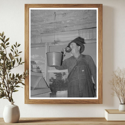 Farmer Drinking from Bucket in Pie Town New Mexico 1940