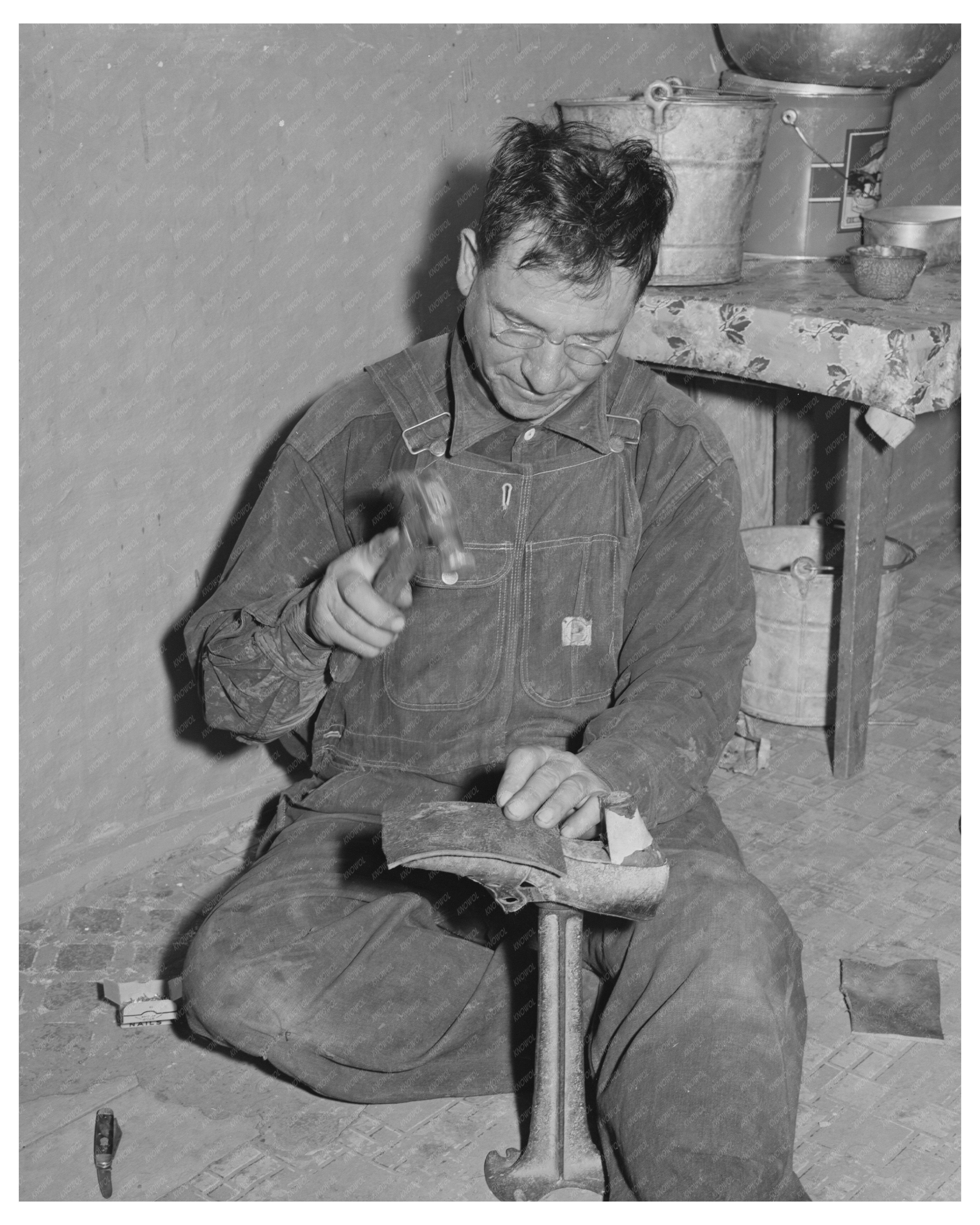 Spanish-American Farmer Repairs Shoes in New Mexico 1940