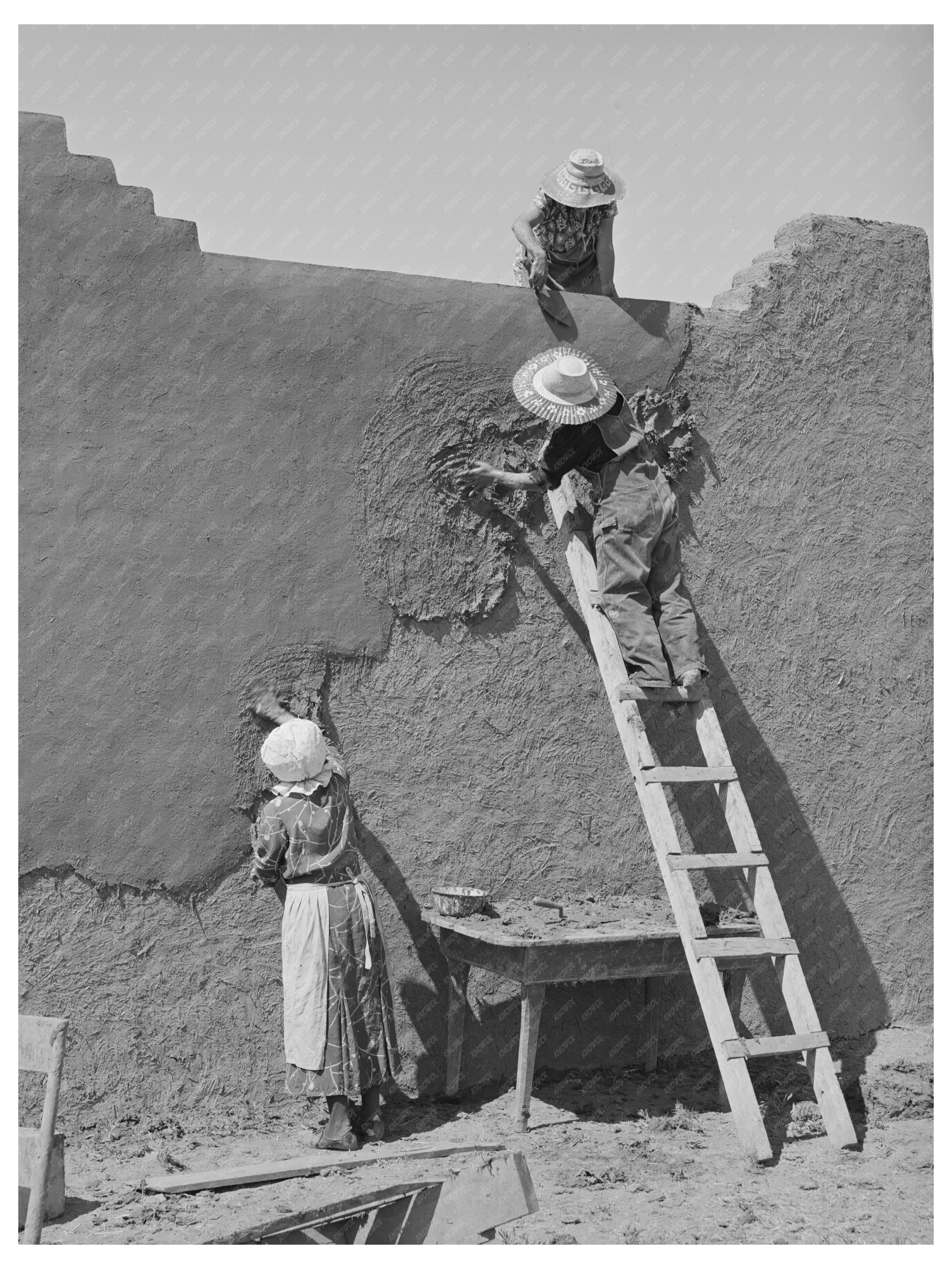 Women Replastering Adobe Houses in Chamisal New Mexico 1940