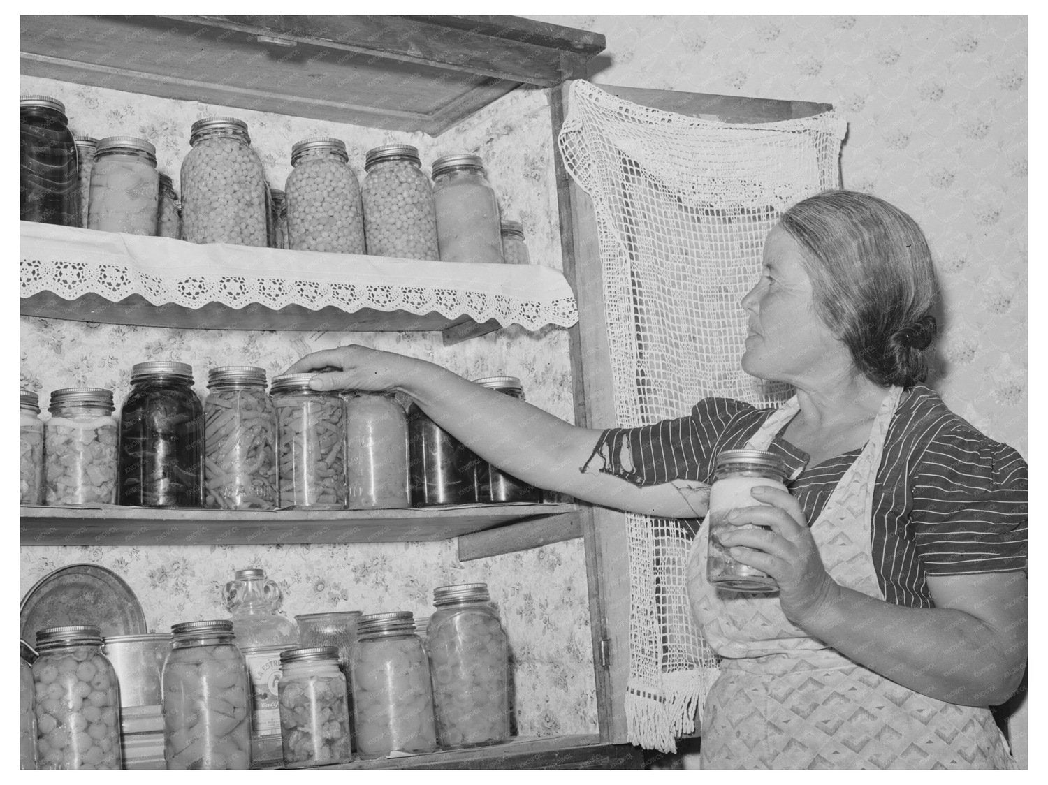 Spanish-American Farmers Wife with Canned Goods 1940
