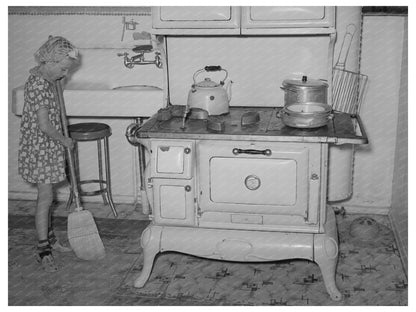Young Girl Sweeping Kitchen in Snowville Utah 1940