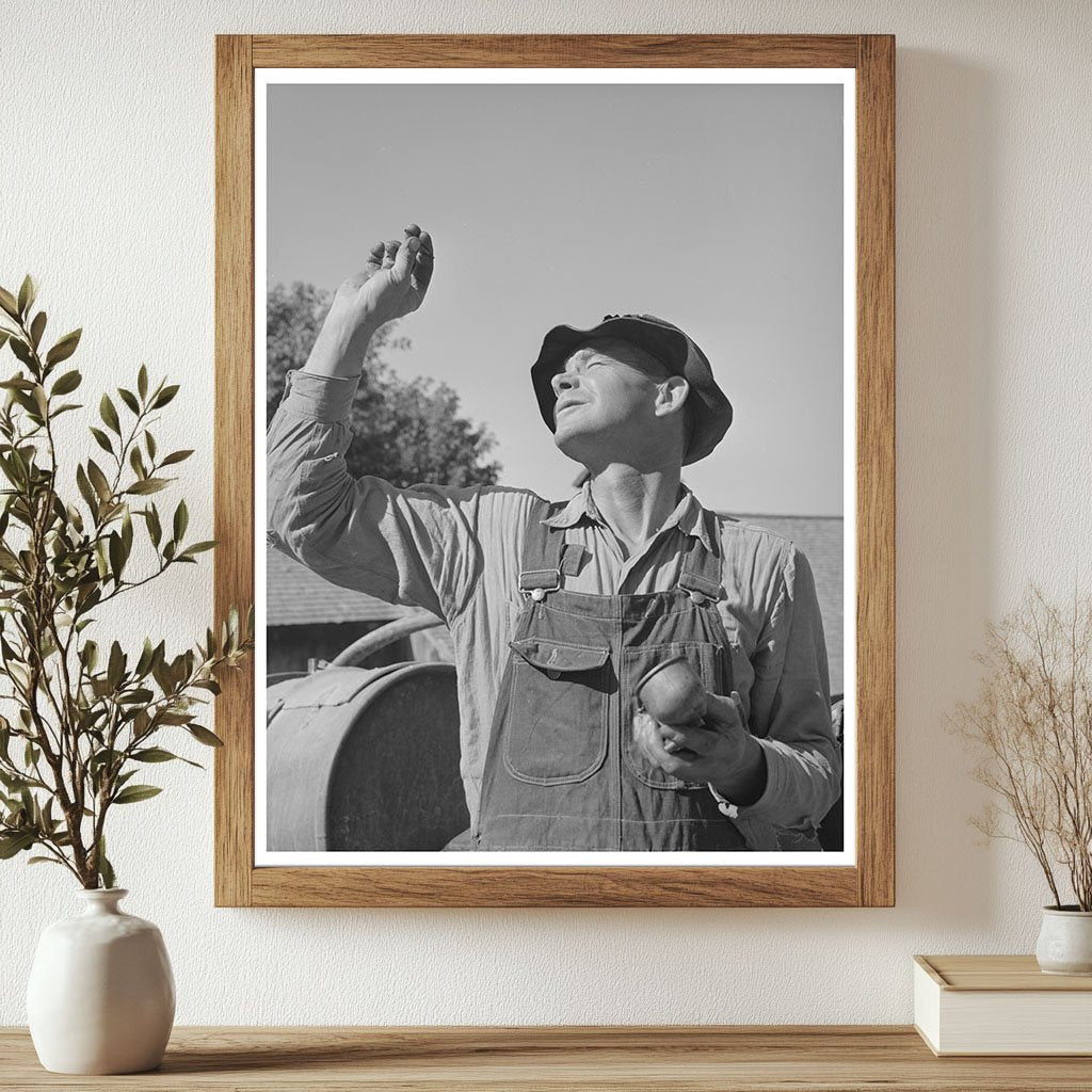 Farmer Inspects Carburetor of Orchard Sprayer August 1940