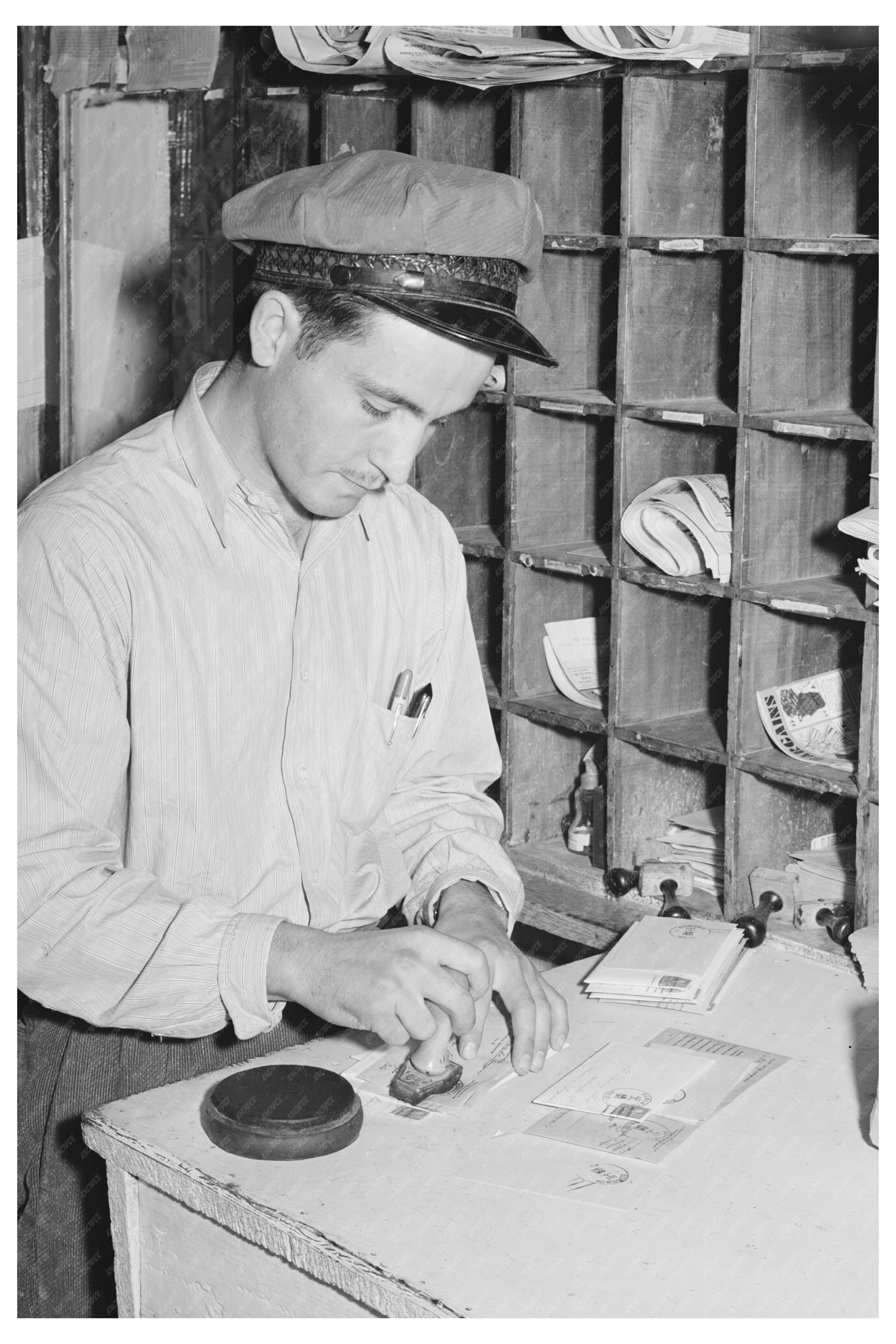 Postmaster Cancelling Stamps in Concho Arizona 1940