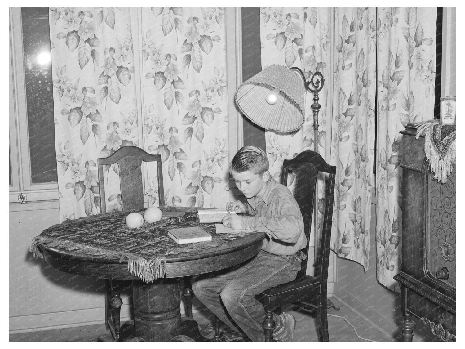 Son of Mr. Schmidt Doing Homework Tulare County 1940