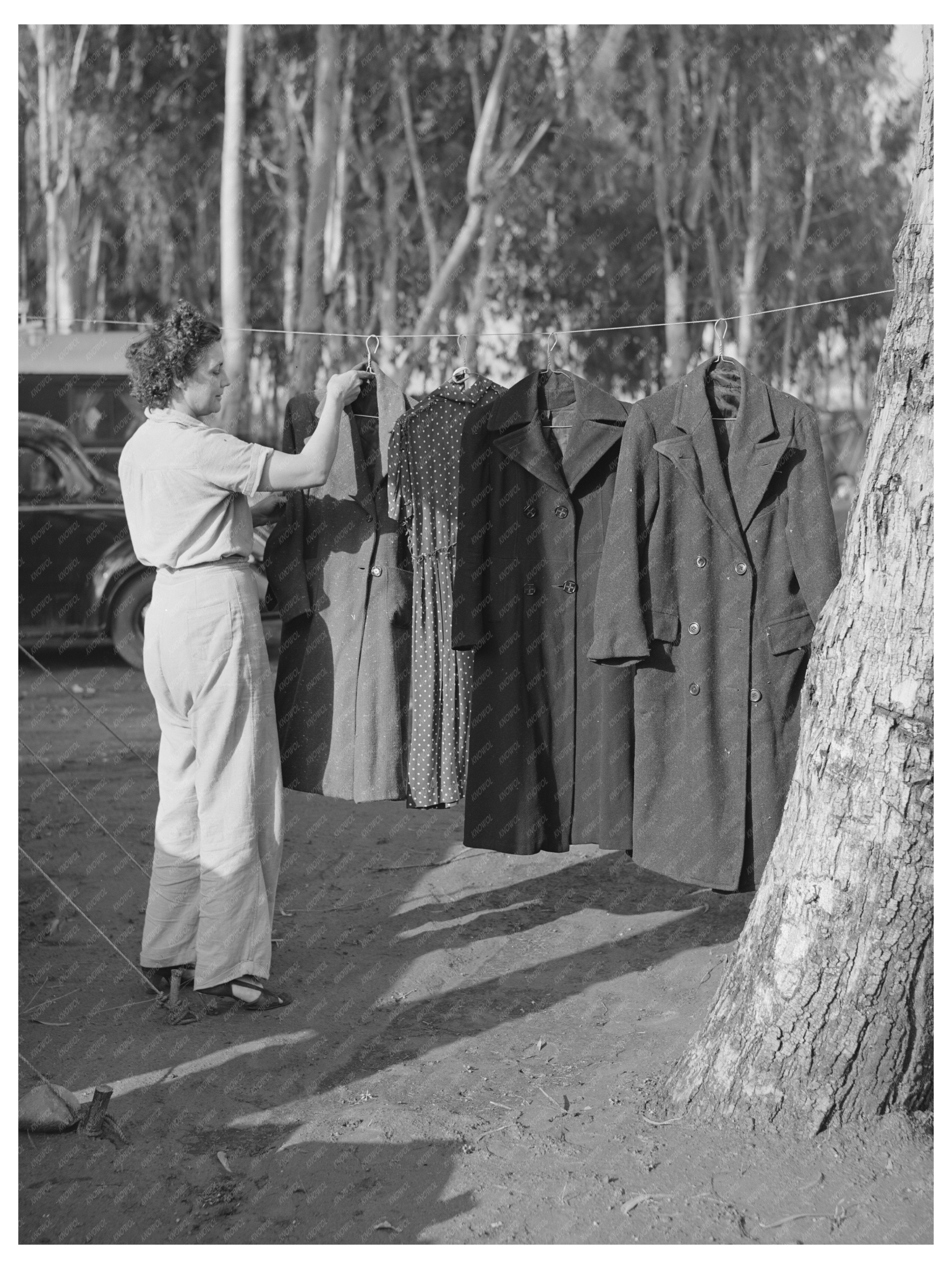 Woman Drying Coat Outside Tent Mission Valley California 1940