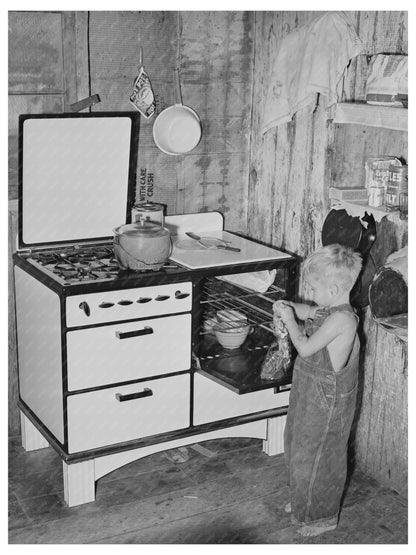 Workmans Son Removing Gingerbread from Stove in 1940