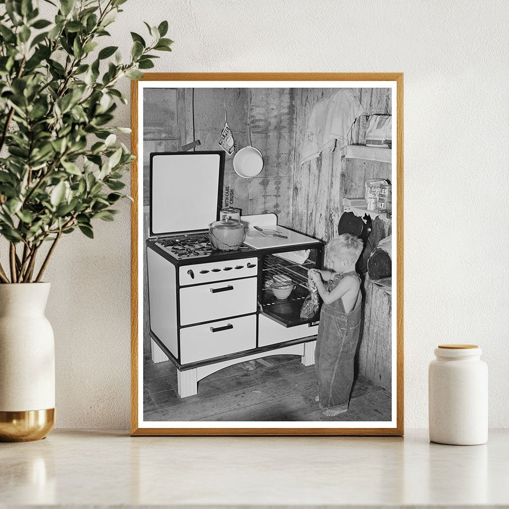 Workmans Son Removing Gingerbread from Stove in 1940