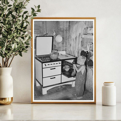 Workmans Son Removing Gingerbread from Stove in 1940