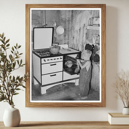 Workmans Son Removing Gingerbread from Stove in 1940