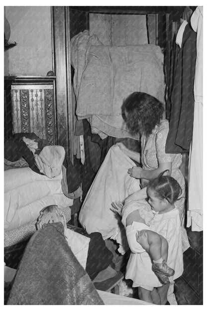 Housewife Inspects Damaged Bedding Chicago April 1941