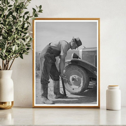 Ray Halstead Pumps Tire in Dead Ox Flat Oregon 1941