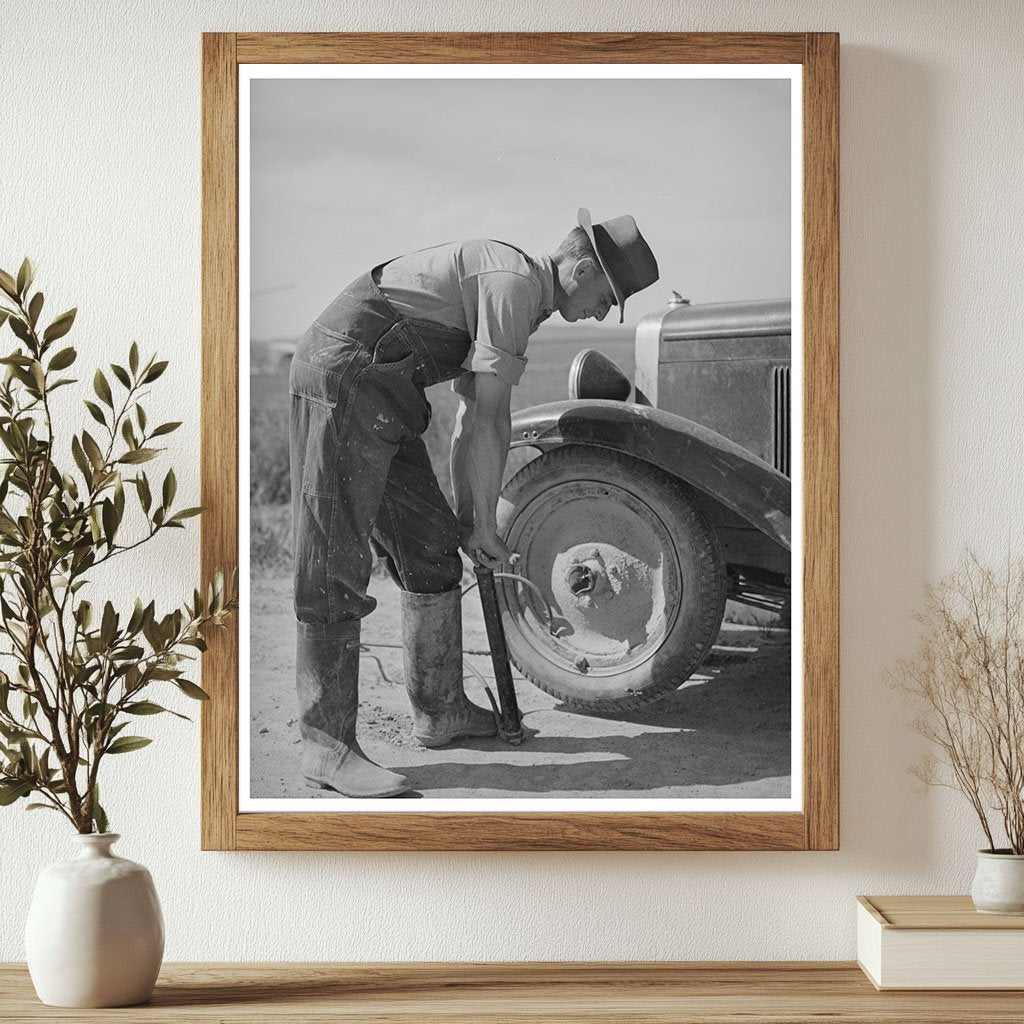 Ray Halstead Pumps Tire in Dead Ox Flat Oregon 1941