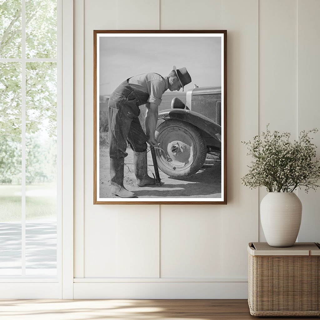 Ray Halstead Pumps Tire in Dead Ox Flat Oregon 1941