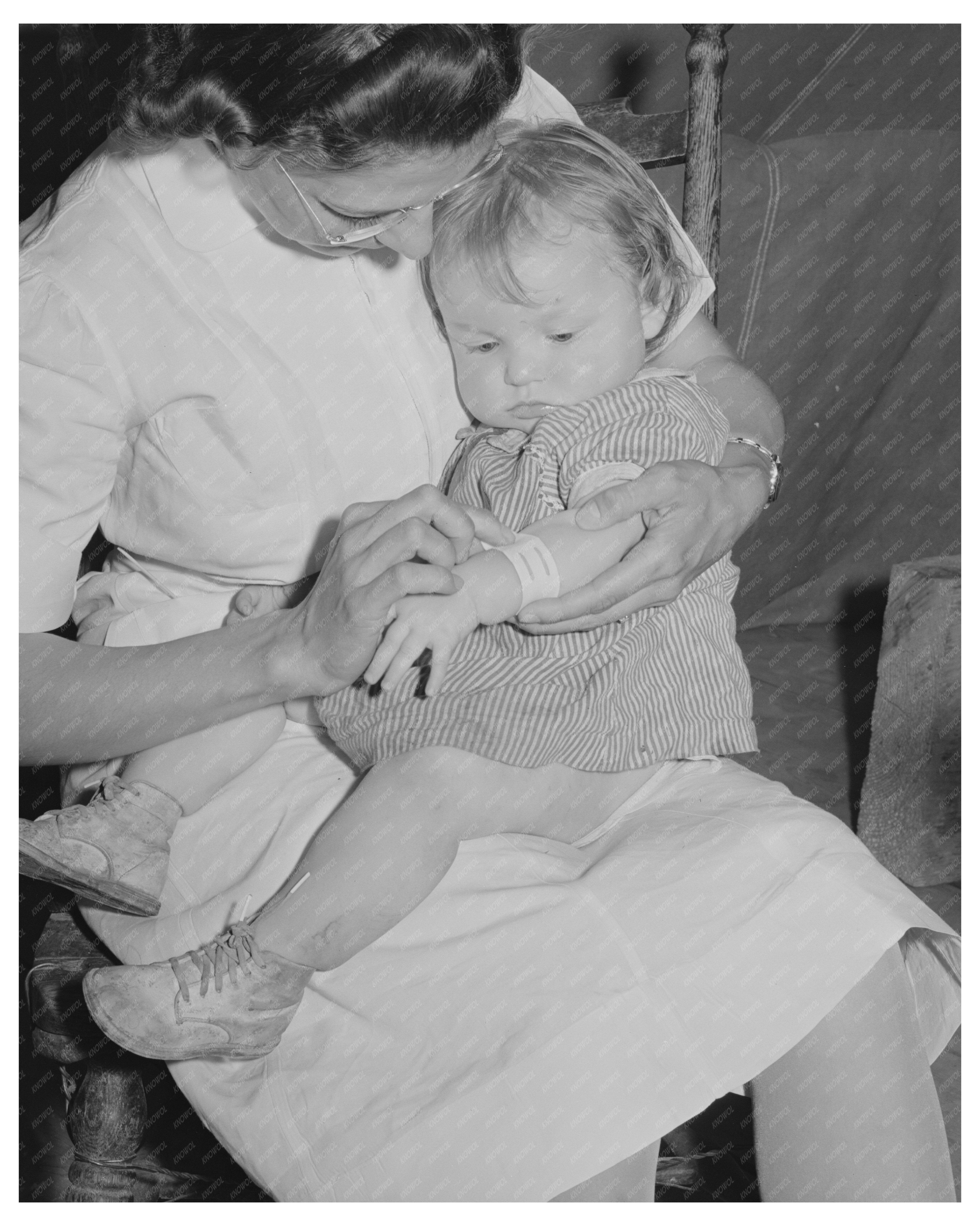 Nurse Examines Babys Cut at Idaho Migrant Camp 1941