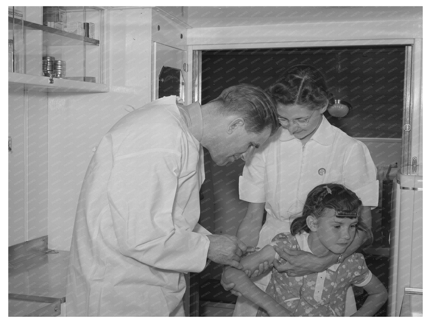 Doctor and Nurse Assist Girl in Mobile Clinic 1941
