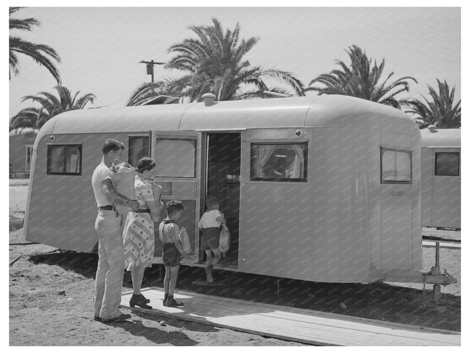 Family Moving into Trailer at FSA Camp San Diego 1941