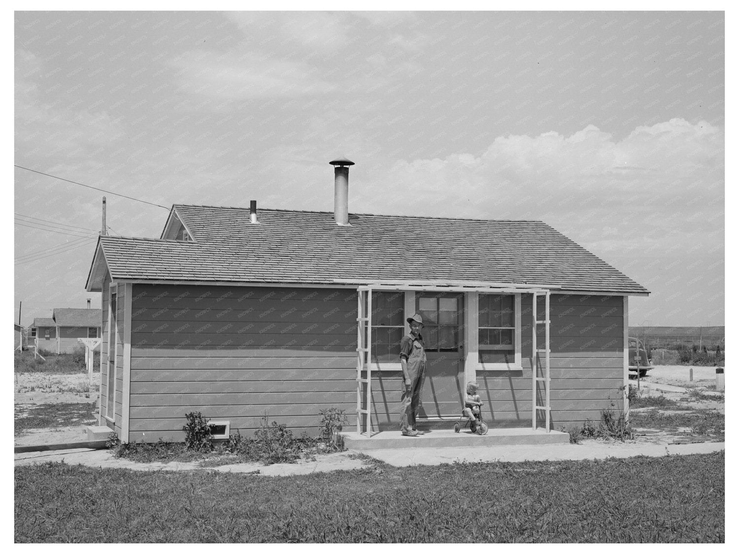 Farm Worker and Son at Idaho Labor Camp June 1941