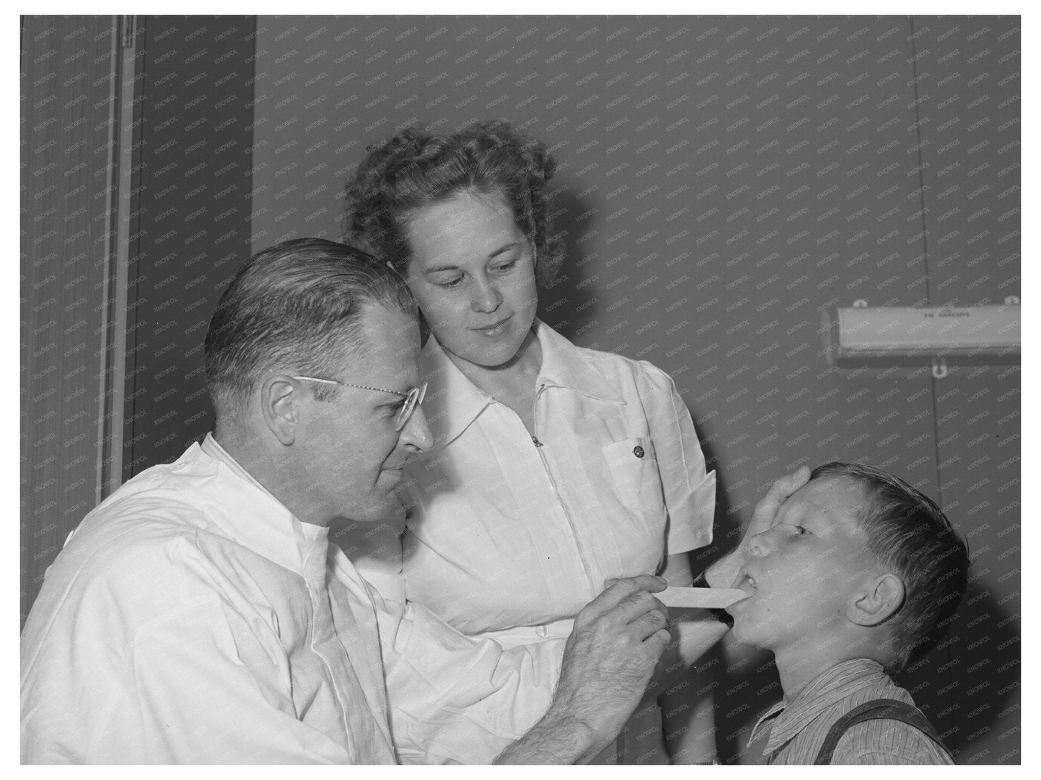 Doctor and nurse attend farm workers son Caldwell Idaho 1941