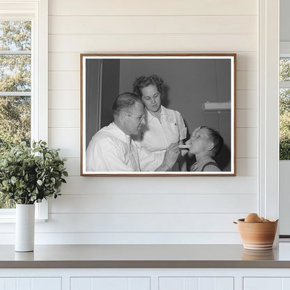 Doctor and nurse attend farm workers son Caldwell Idaho 1941