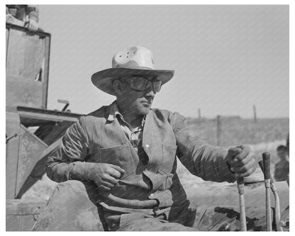 Driver on Caterpillar Tractor Pulling Combine July 1941