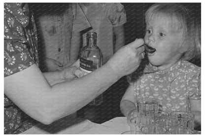 Young Girl Taking Cod Liver Oil in Yakima 1941