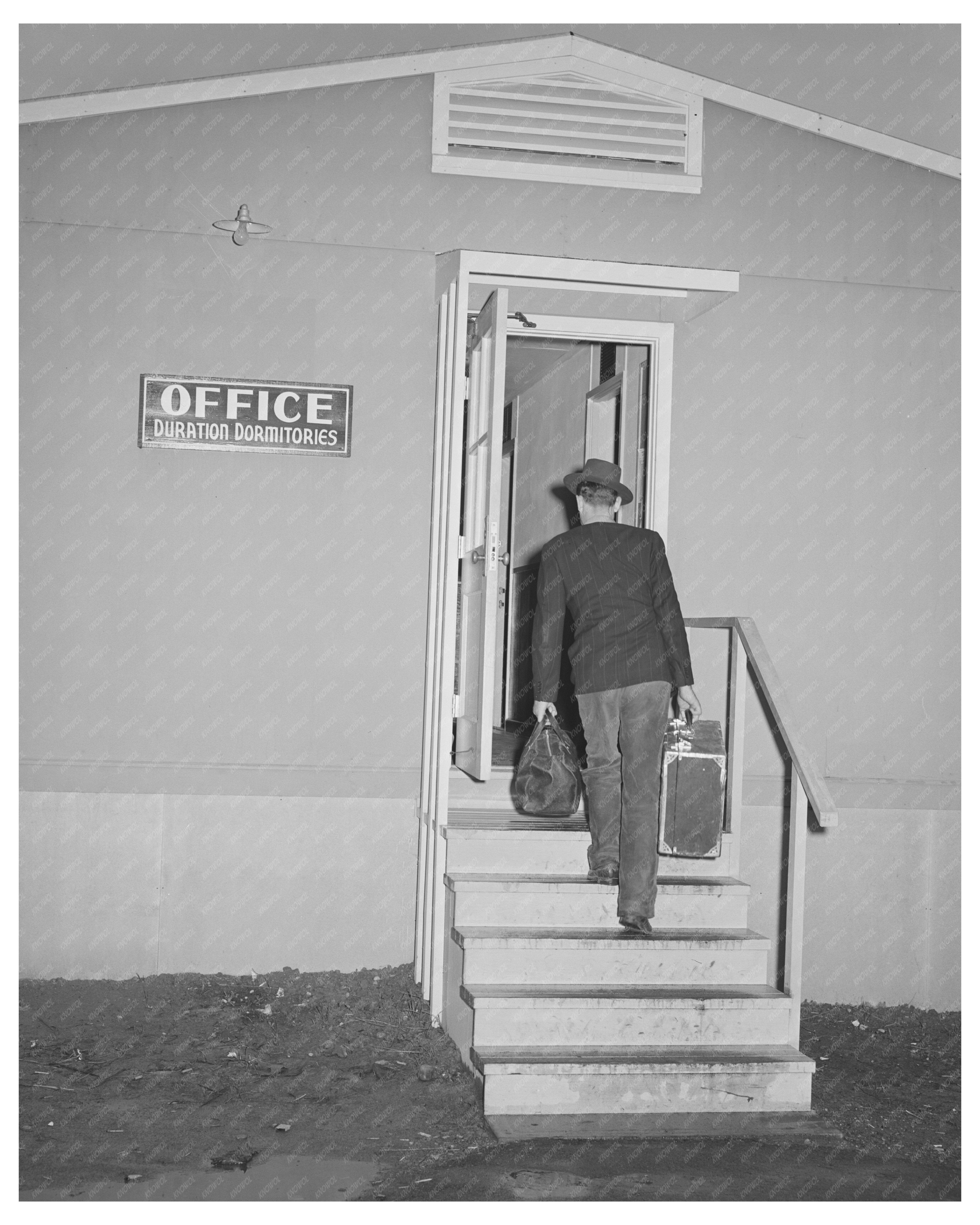 1941 Workman Arrives at Bremerton FSA Dormitory
