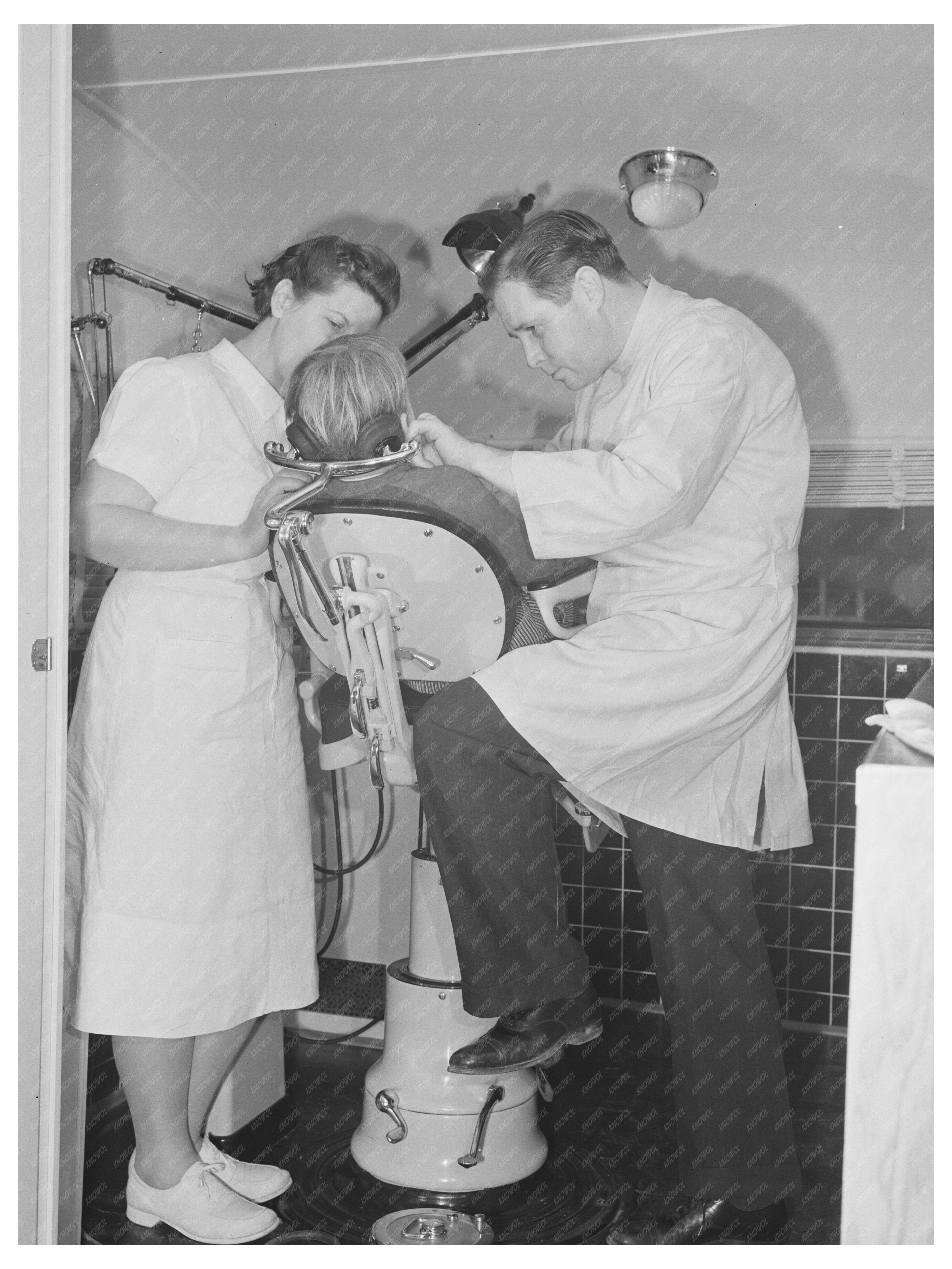 FSA Dentist and Nurse Treat Migrant Child Caldwell Idaho 1941