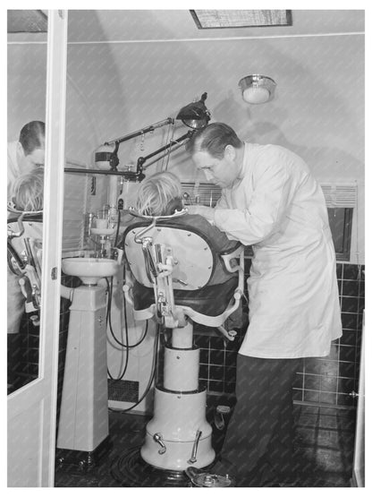 Dentist Treats Migrant Child in Idaho FSA Camp 1941