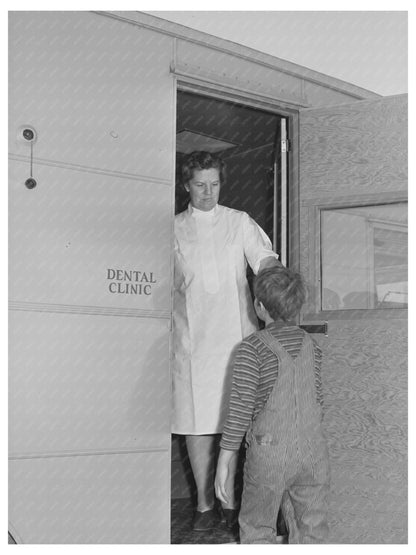 Nurse Welcomes Migrant Boy to Dental Trailer 1941