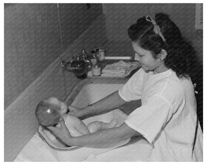 Girl Learning to Bathe Infant in Arizona 1942