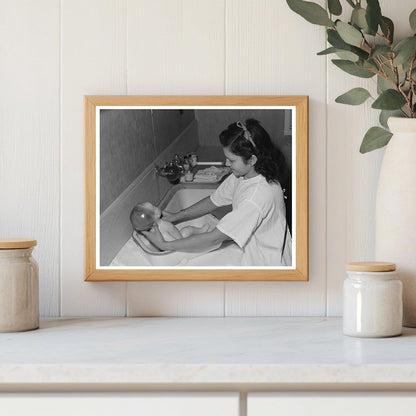 Girl Learning to Bathe Infant in Arizona 1942