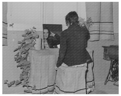 Schoolgirl at Dressing Table in FSA Community February 1942