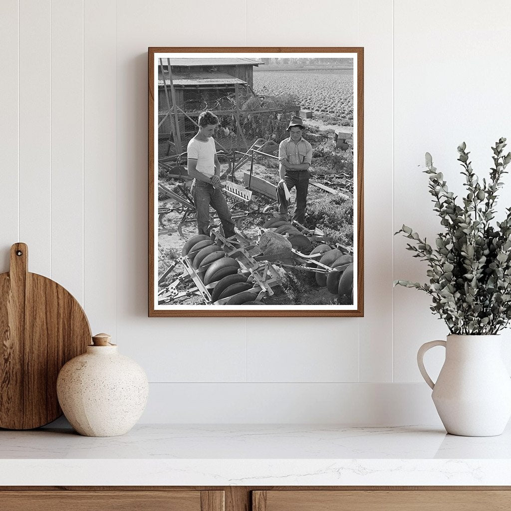 1942 Farmer Examines Equipment Amid Japanese Evacuation