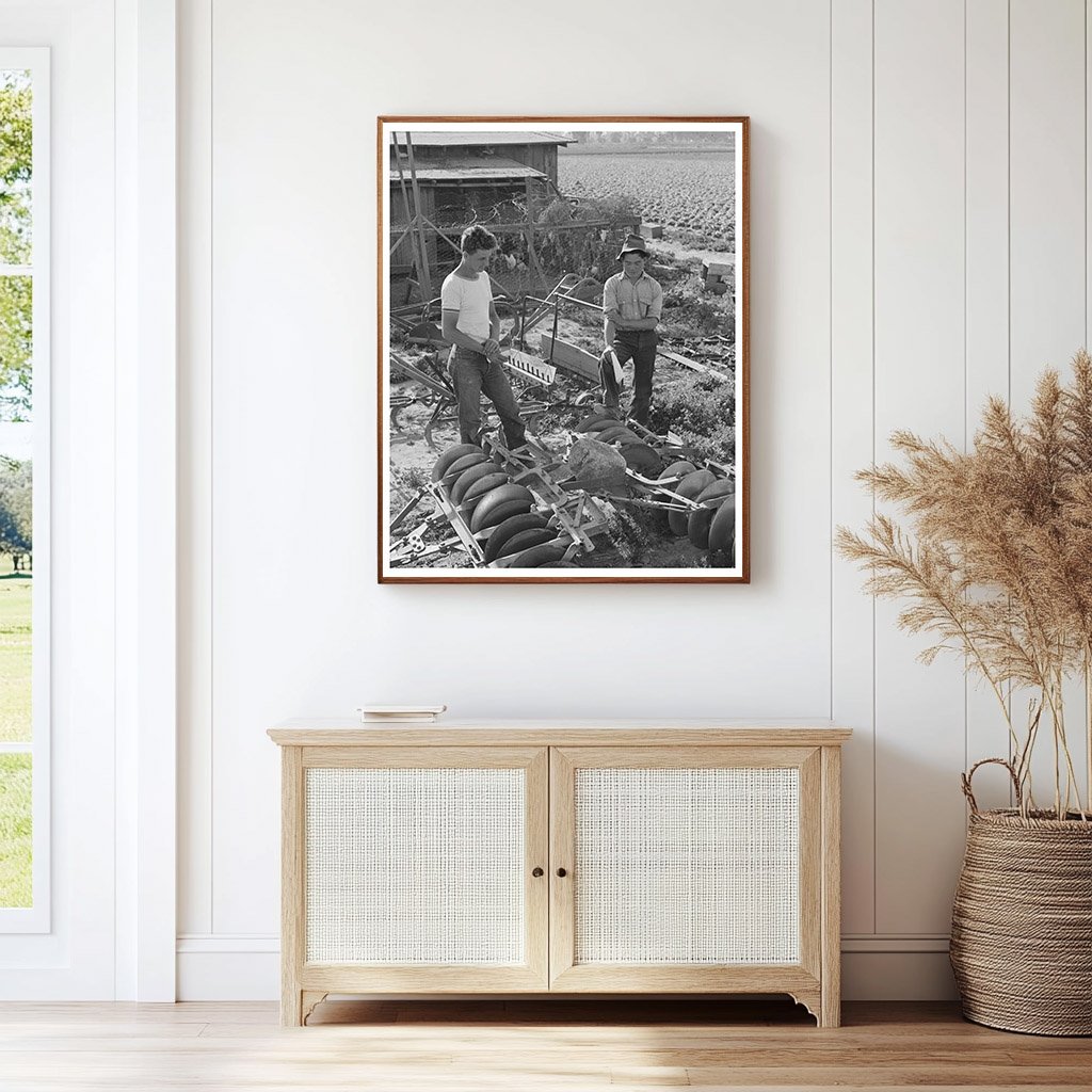 1942 Farmer Examines Equipment Amid Japanese Evacuation