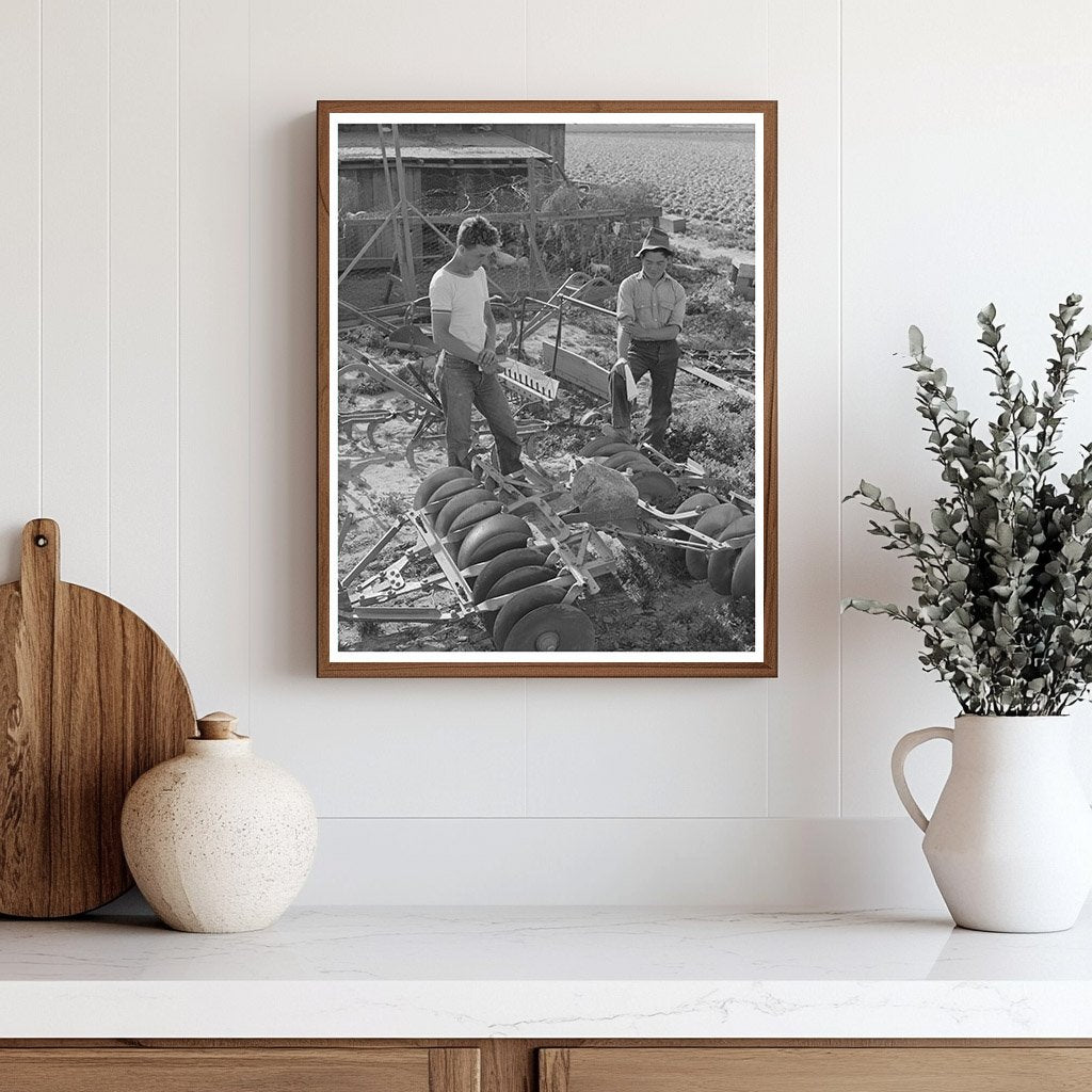 Farmer Examines Equipment Los Angeles County 1942