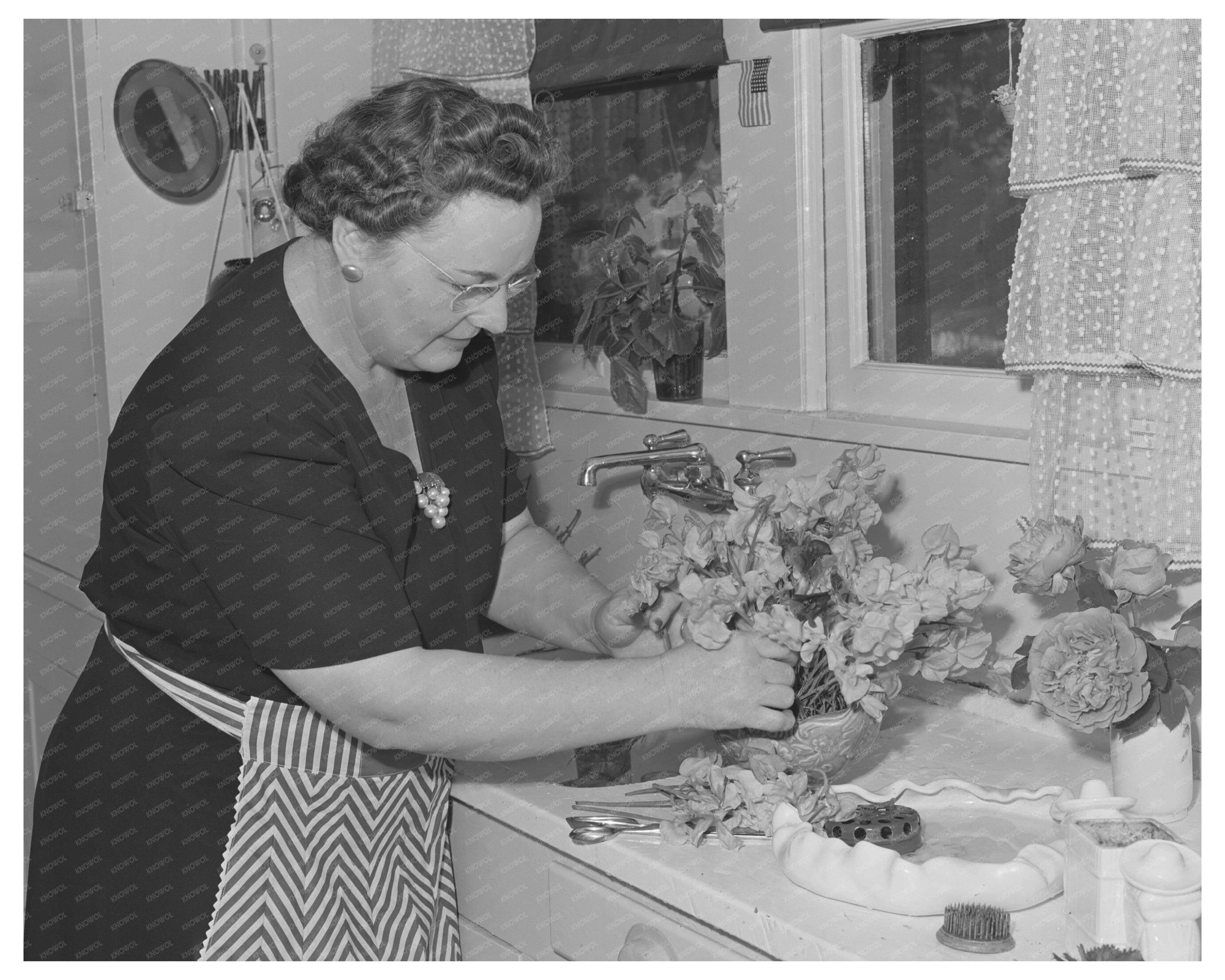 1942 Black and White Photo of Housewife in Turlock Kitchen