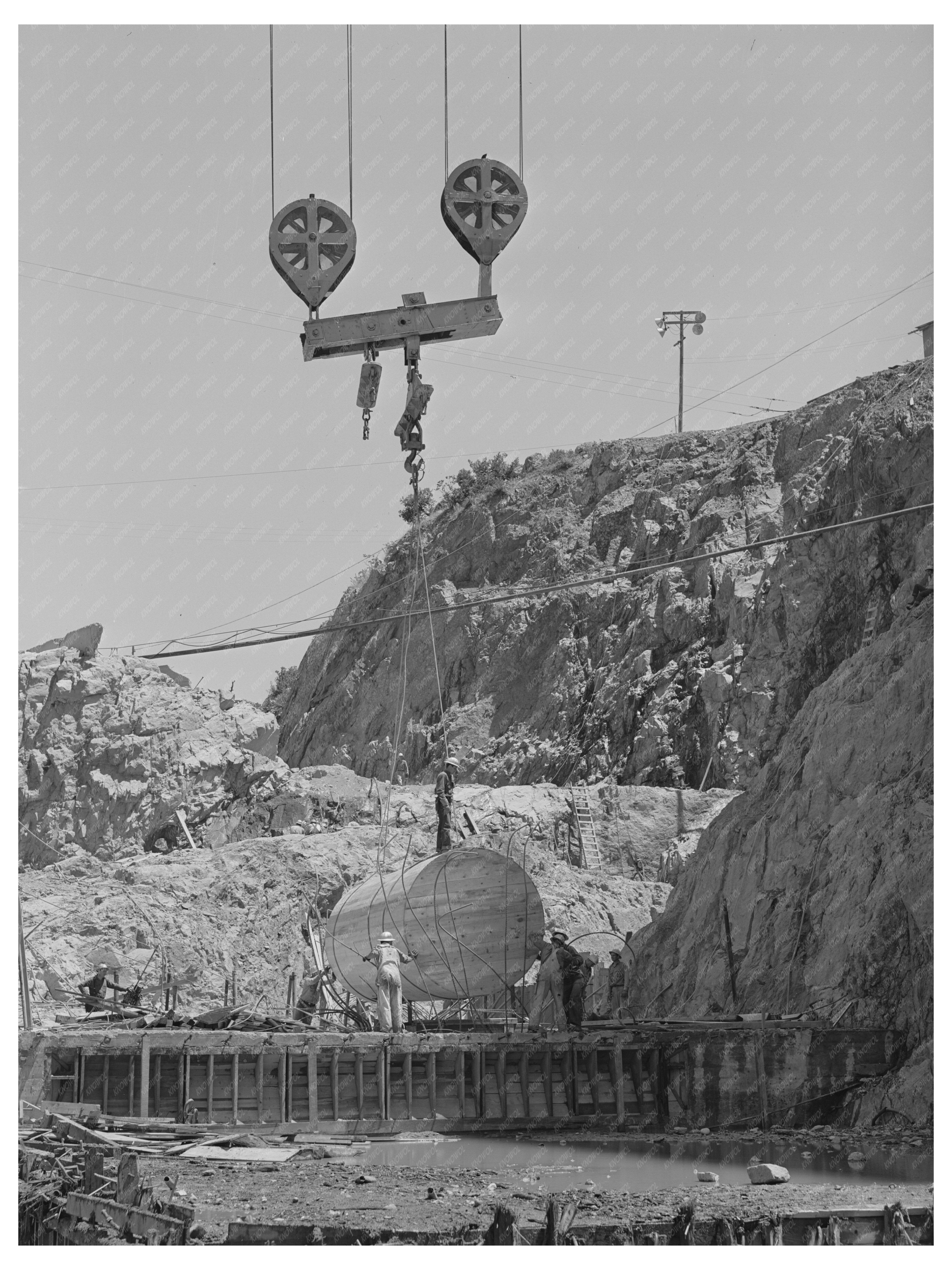 Shasta Dam Workers Lowering Sump June 1942