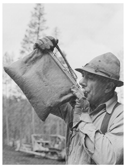 Lumberjack Drinking from Water Bag in Oregon 1942