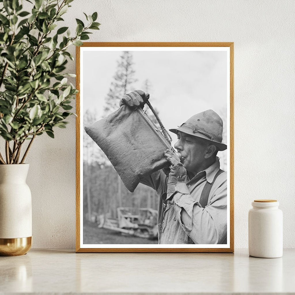 Lumberjack Drinking from Water Bag in Oregon 1942