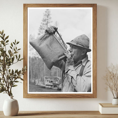 Lumberjack Drinking from Water Bag in Oregon 1942