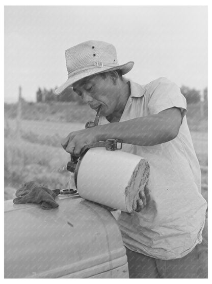 Japanese-American Worker on Tractor Radiator July 1942