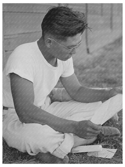 Japanese-American Reading Mail at Idaho Camp July 1942