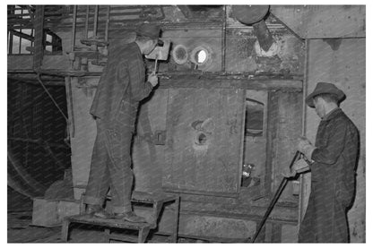 Workman Inspects Manganese Ore Roasting 1942