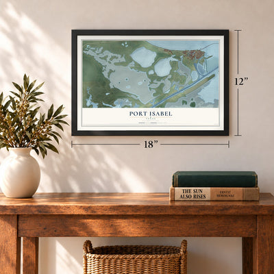 Port Isabel, Texas map, 12 x 18 inch print in a black frame in an entryway