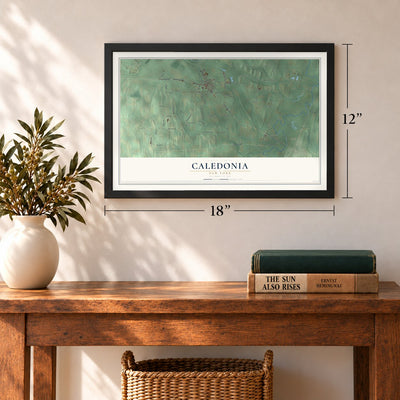 Caledonia, New York map, 12 x 18 inch print in a black frame in an entryway